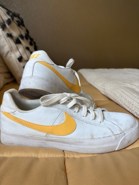 Nike Shoes - Nike White Canvas Sneakers with Yellow Swoosh Accent